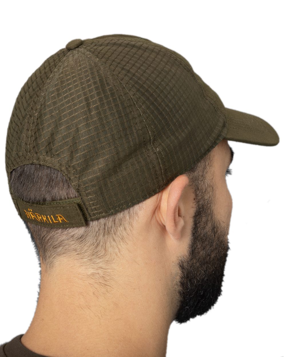Willow Green Coloured Harkila Instinct Cap on white background #colour_willow-green