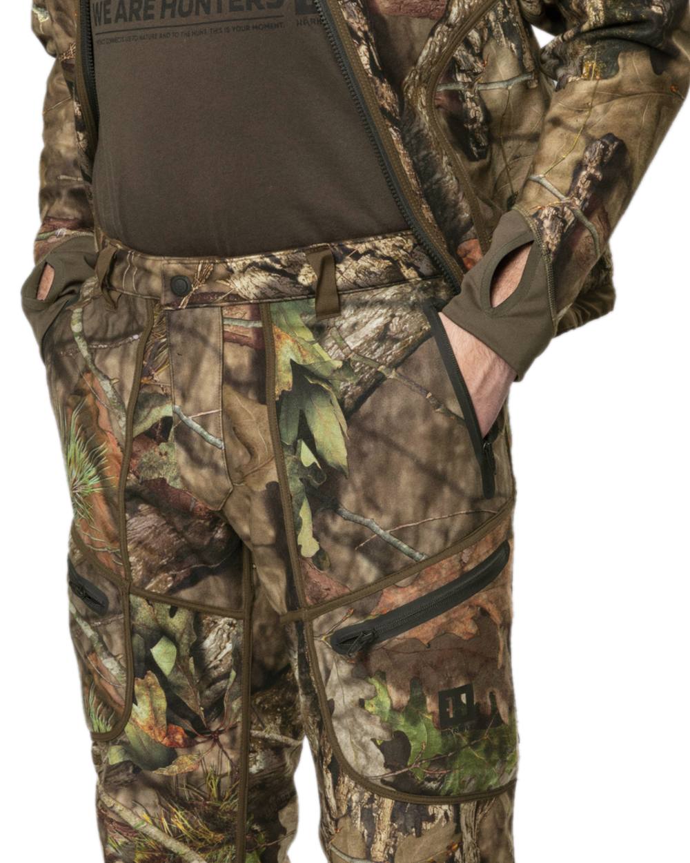 Hunting Green MossyOak Coloured Harkila Kamko Camo Reversible WSP Trousers on white background #colour_hunting-green-mossyoak
