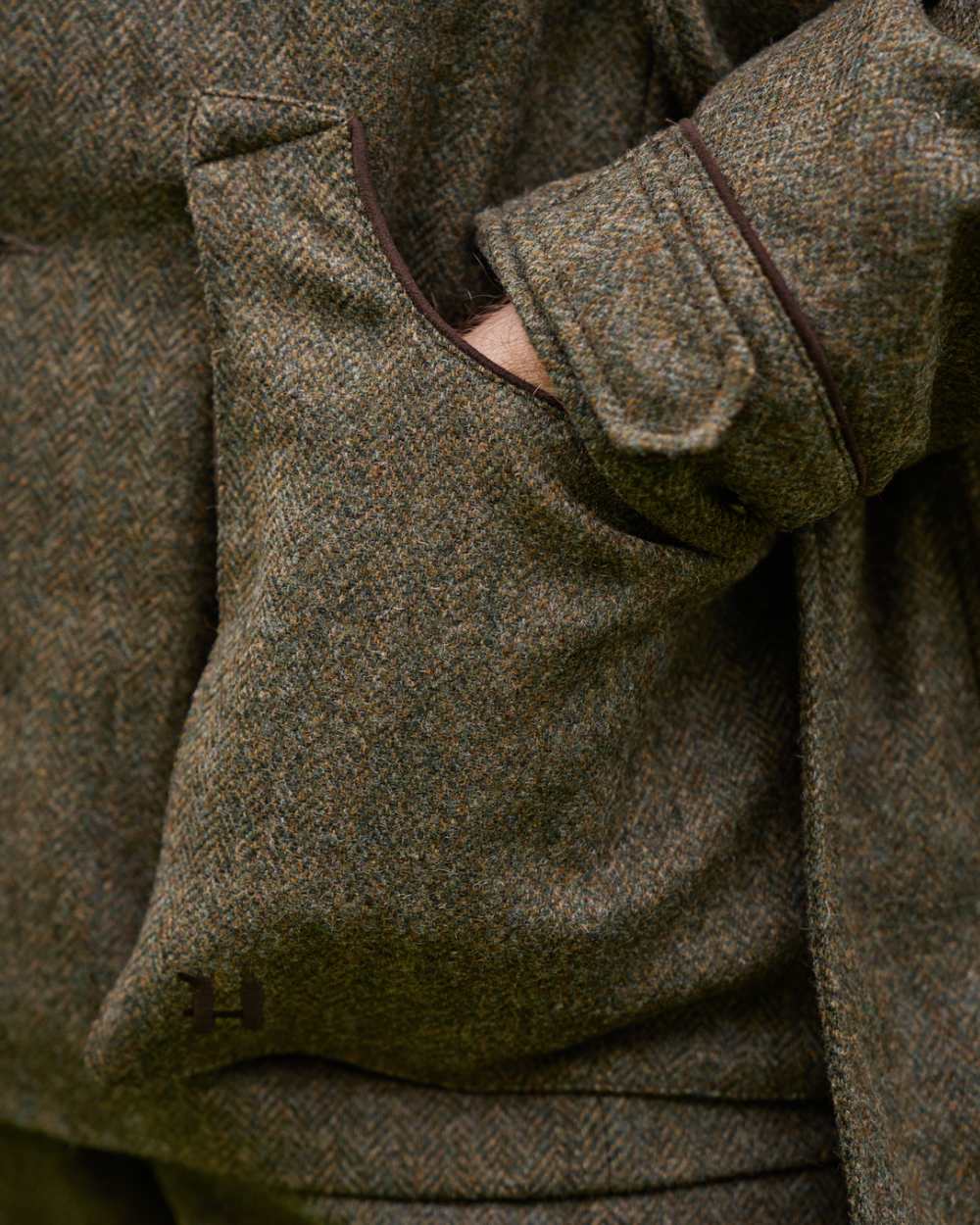 Forest Green Herringbone coloured Harkila Kenmore Shooting Waistcoat on white background #colour_forest-green-herringbone