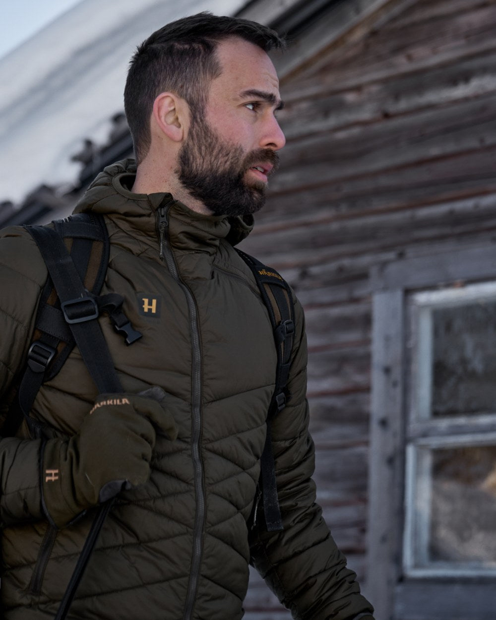 Willow Green Coloured Harkila Logmar Insulated Packable Hooded Jacket on snow background #colour_willow-green