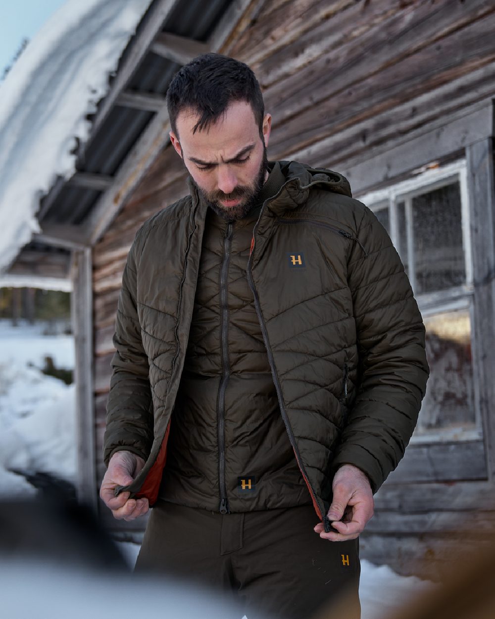 Willow Green Coloured Harkila Logmar Insulated Packable Waistcoat on outdoor background #colour_willow-green