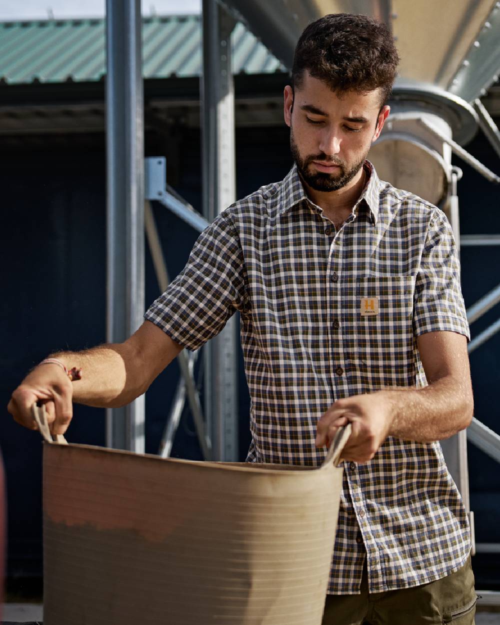 Naval Blue Check Coloured Harkila Mens Fjell Short Sleeve Shirt on construction background #colour_naval-blue-check