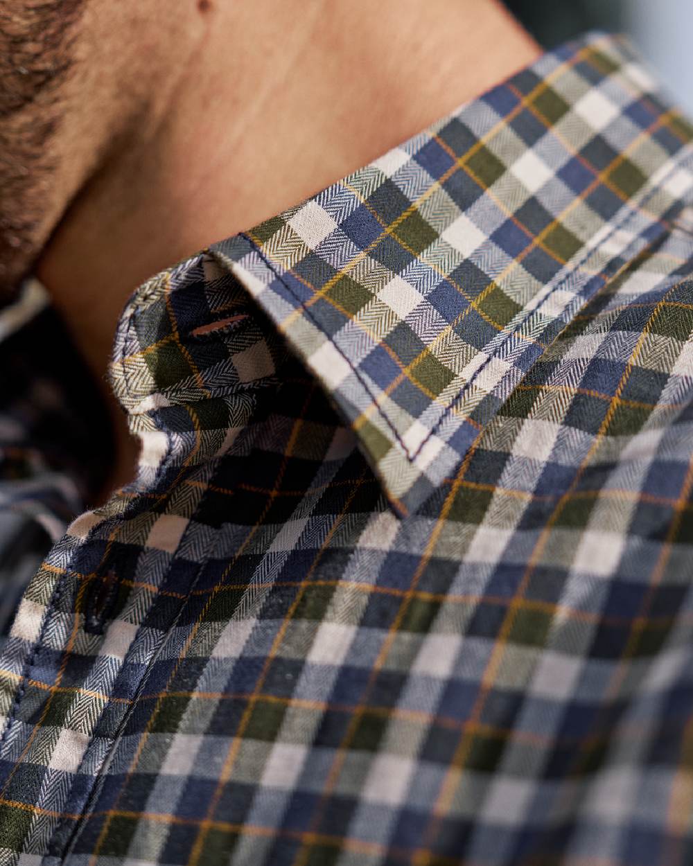 Naval Blue Check Coloured Harkila Mens Fjell Short Sleeve Shirt on blurry background #colour_naval-blue-check