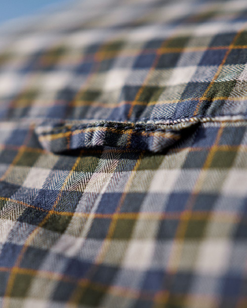 Naval Blue Check Coloured Harkila Mens Fjell Short Sleeve Shirt on blurry background #colour_naval-blue-check