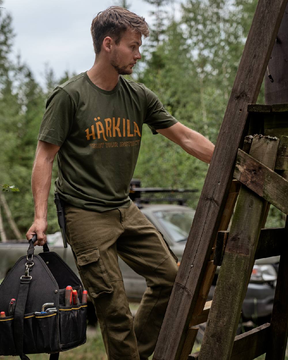 Rosin Coloured Harkila Modi Short Sleeve T-Shirt on forest background #colour_rosin