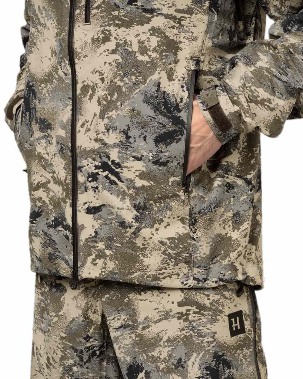 AXIS Mountain Coloured Harkila Mountain Hunter Expedition HWS Packable Jacket on white background #colour_axis-mountain
