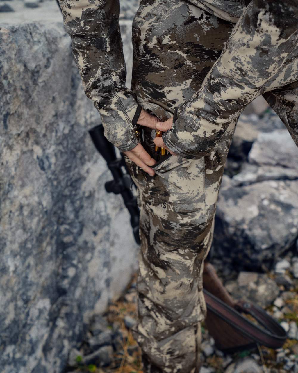 AXIS Mountain Coloured Harkila Mountain Hunter Expedition Light Trousers on outdoor background #colour_axis-mountain