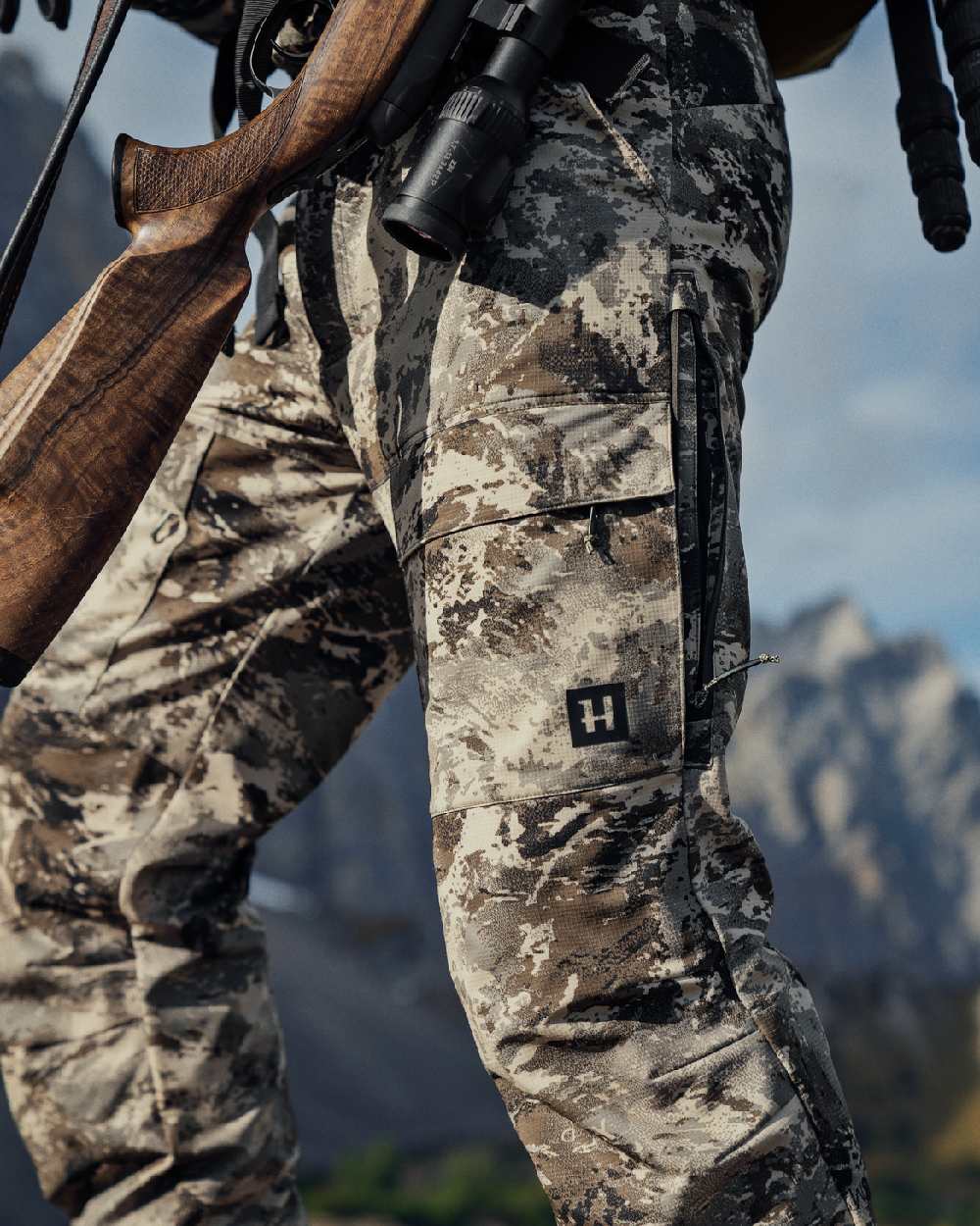 AXIS Mountain Coloured Harkila Mountain Hunter Expedition Light Trousers on outdoor background #colour_axis-mountain