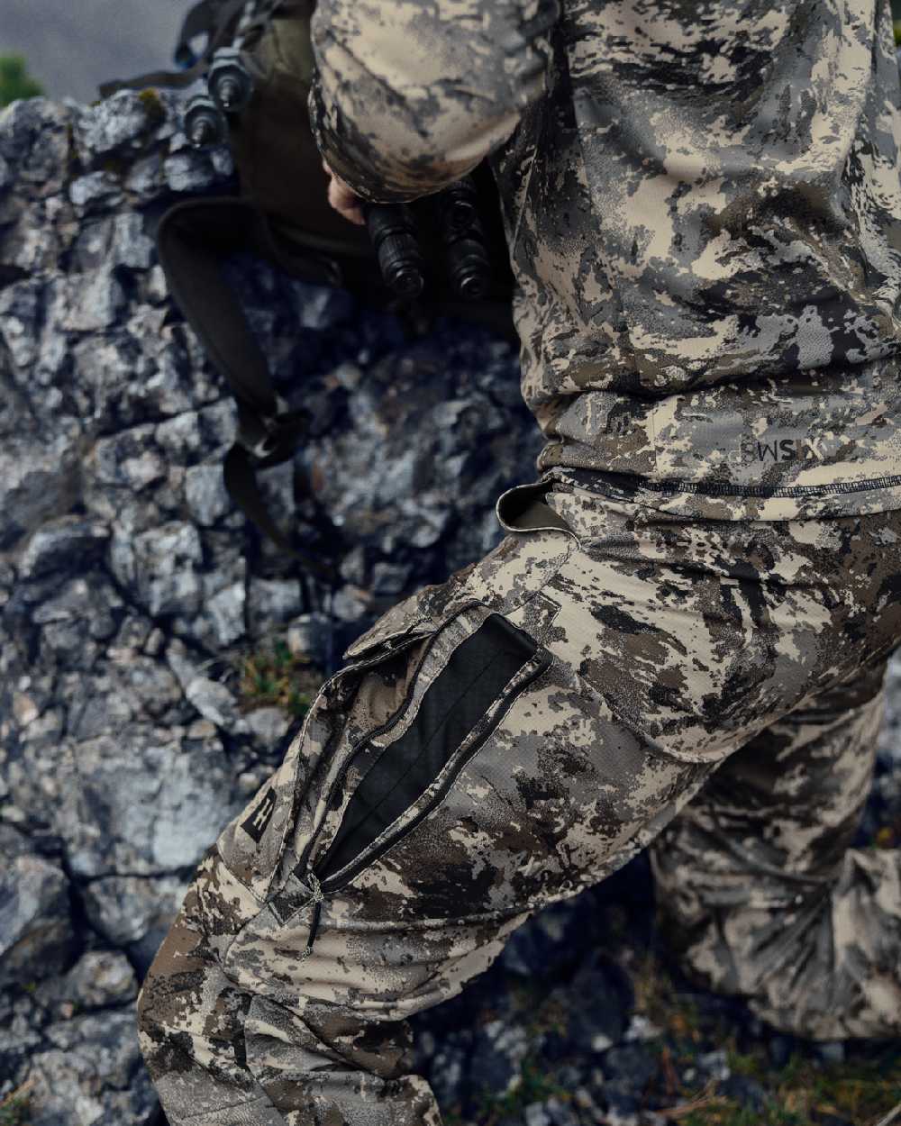 AXIS Mountain Coloured Harkila Mountain Hunter Expedition Light Trousers on outdoor background #colour_axis-mountain