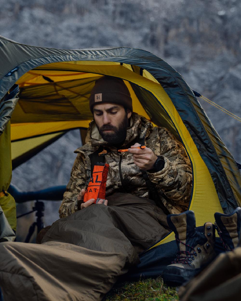 AXIS Mountain Coloured Harkila Mountain Hunter Expedition Packable Down Jacket on outdoor background #colour_axis-mountain