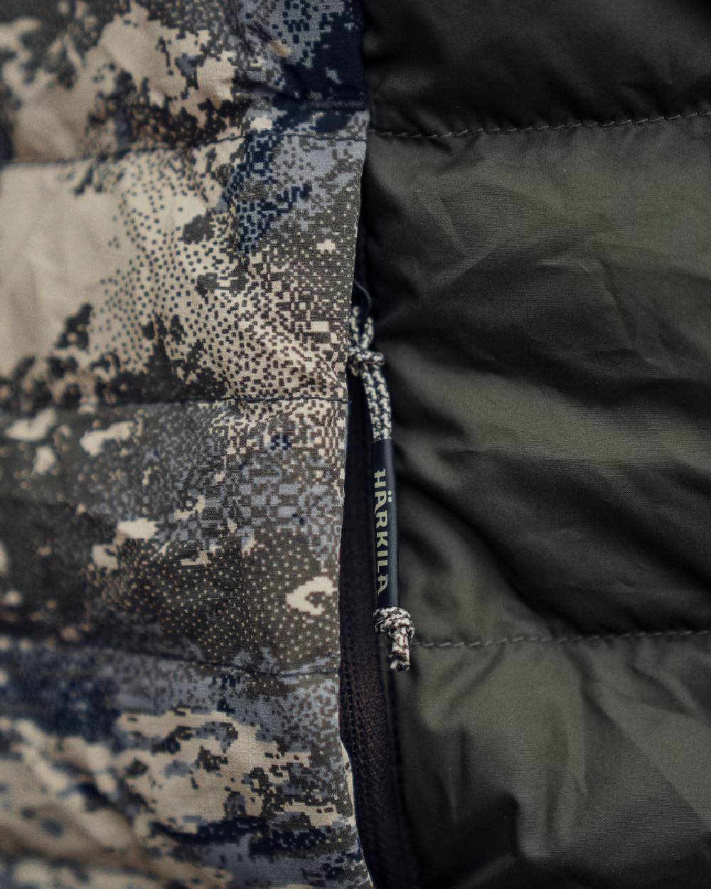 AXIS Mountain Shadow Brown Coloured Harkila Mountain Hunter Expedition Reversible Down Waistcoat on mountain background #colour_axis-mountain-shadow-brown