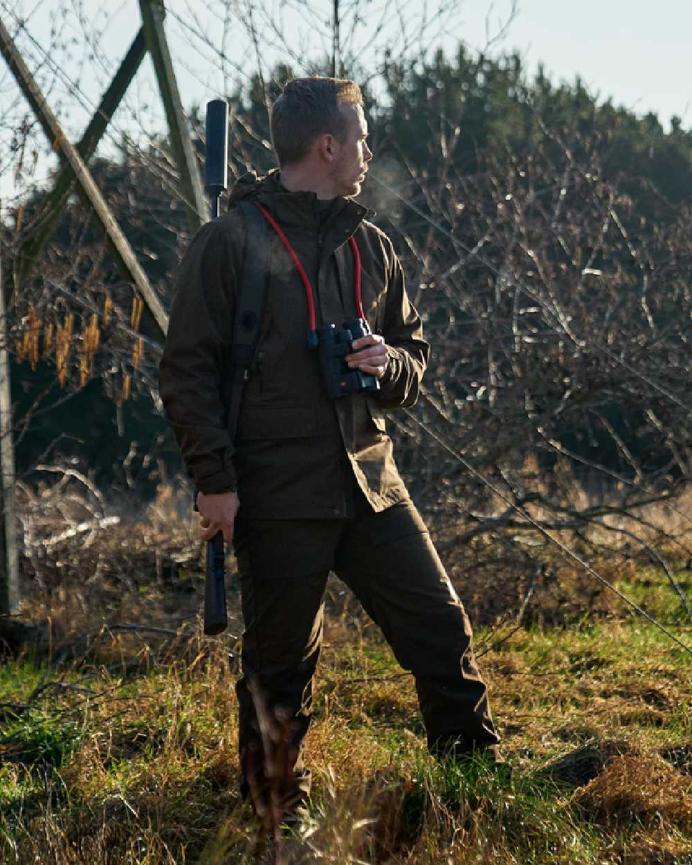 Willow Green Coloured Harkila Nordic Hunter HWS Jacket on outdoor background #colour_willow-green