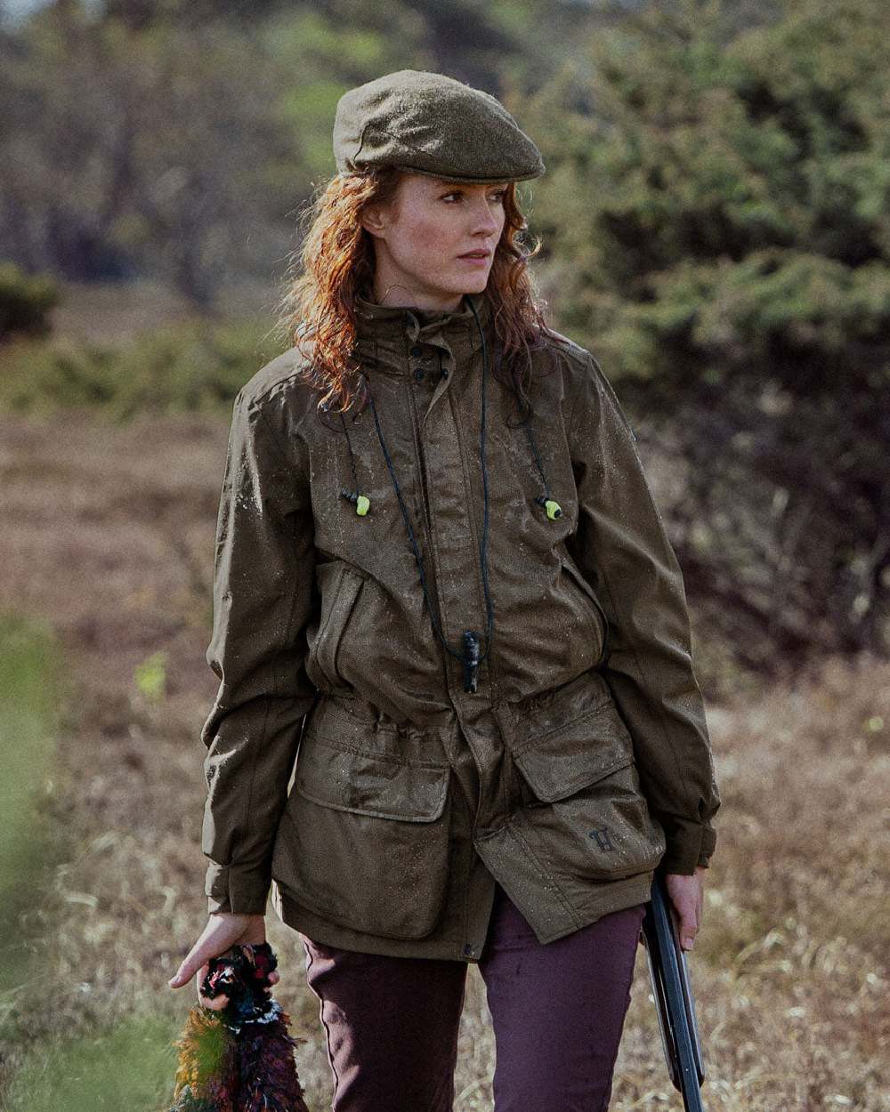 Willow Green Coloured Harkila Orton Packable Lady Jacket on outdoor background #colour_willow-green