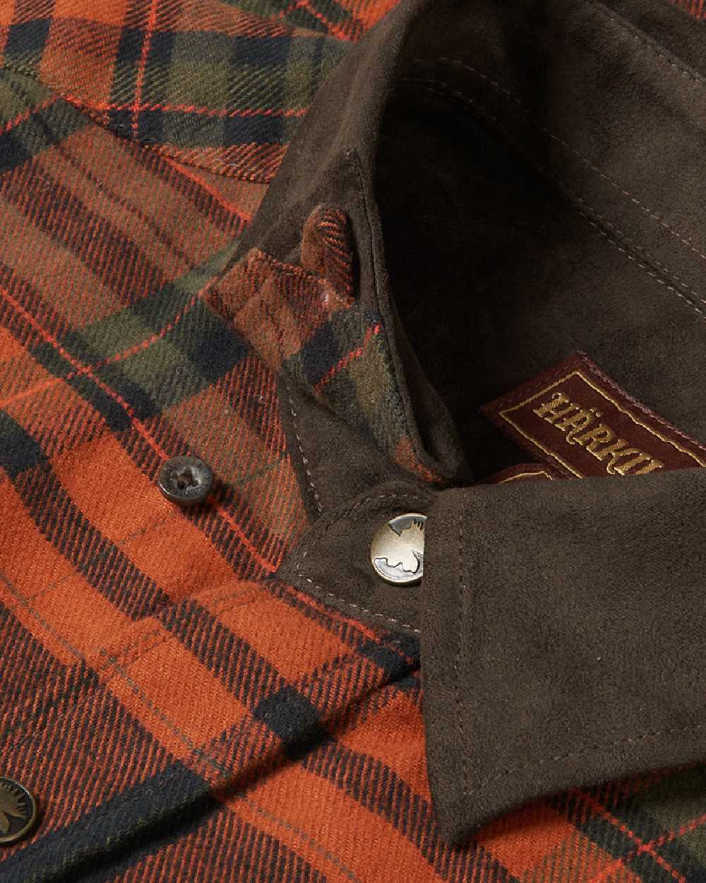 Burnt Orange Coloured Harkila Pajala Check Shirt on white background #colour_burnt-orange