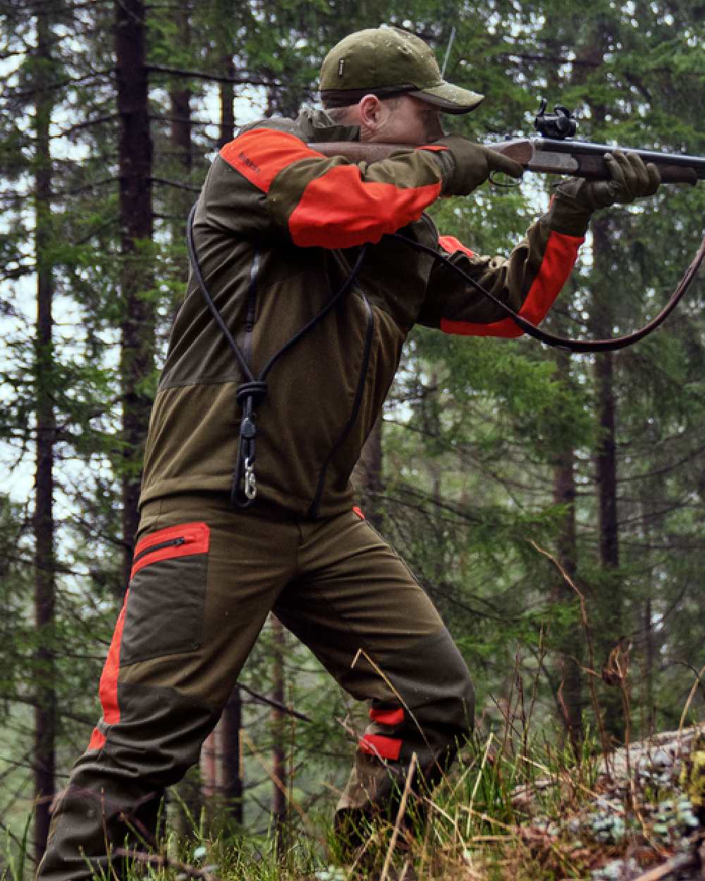 Willow Green Orange Coloured Harkila Pro Hunter Dog Keeper GTX Jacket on outdoor background #colour_willow-green-orange