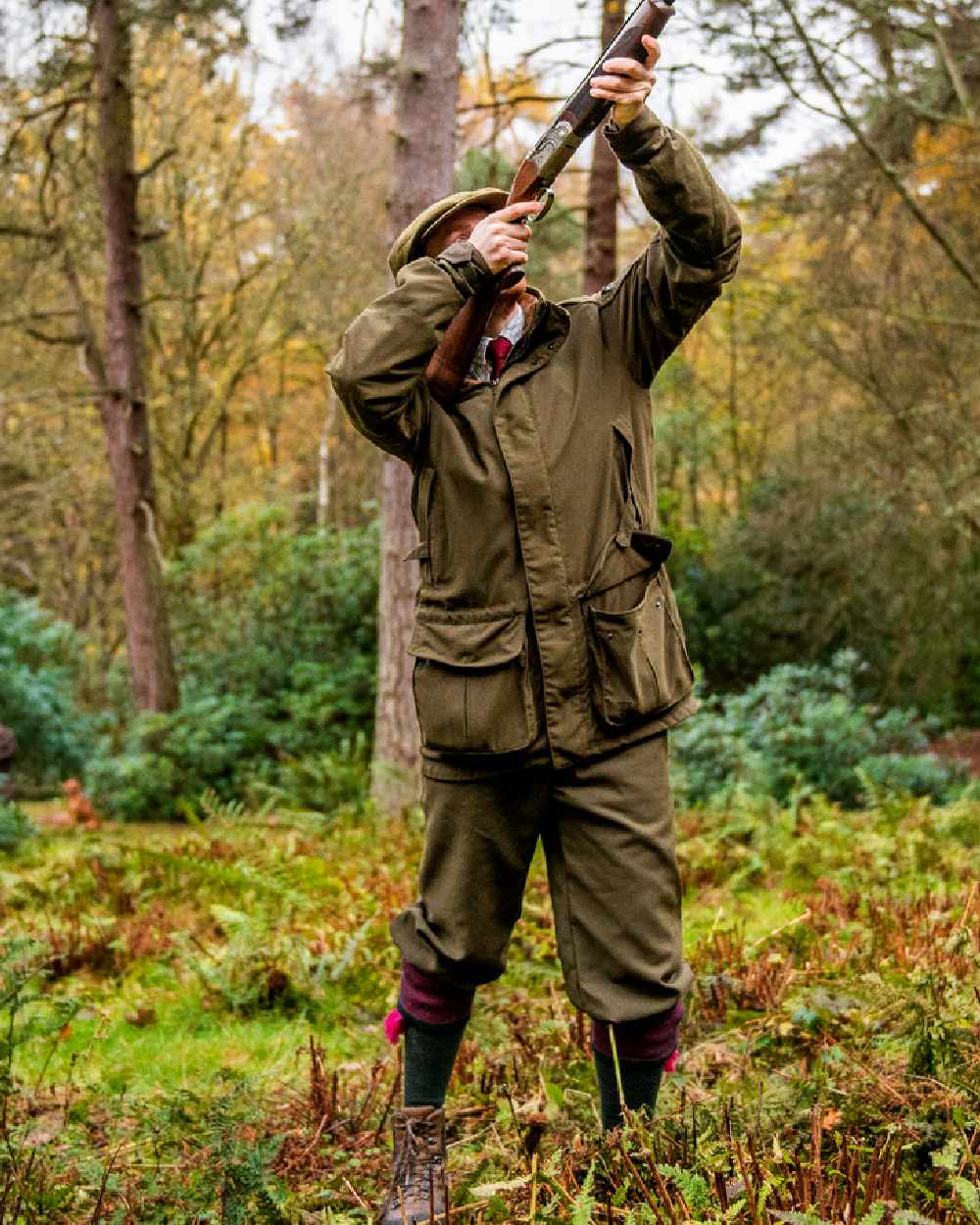 Willow Green Coloured Harkila Pro Hunter Endure Jacket on forest background #colour_willow-green