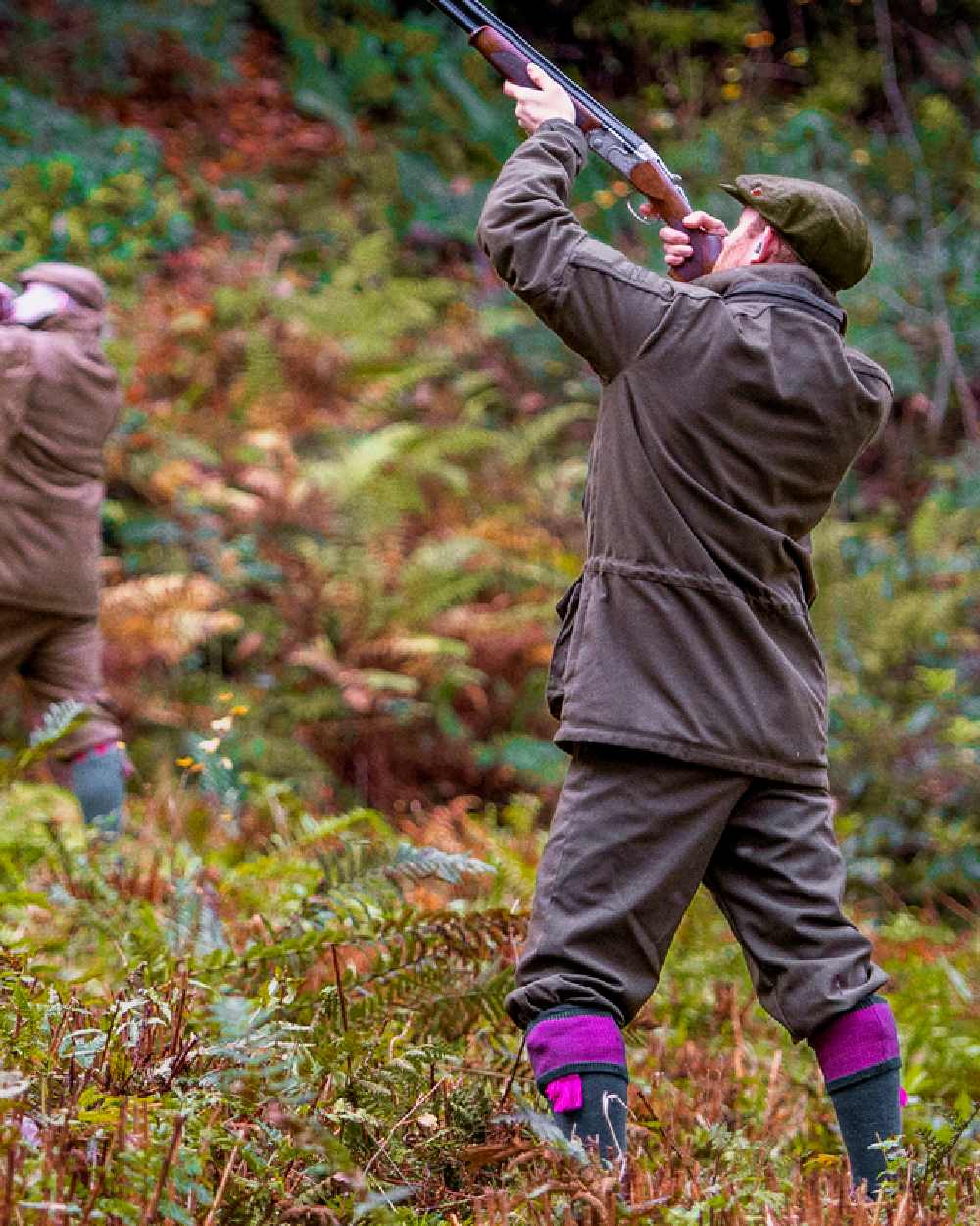Willow Green Coloured Harkila Pro Hunter Endure Jacket on forest background #colour_willow-green