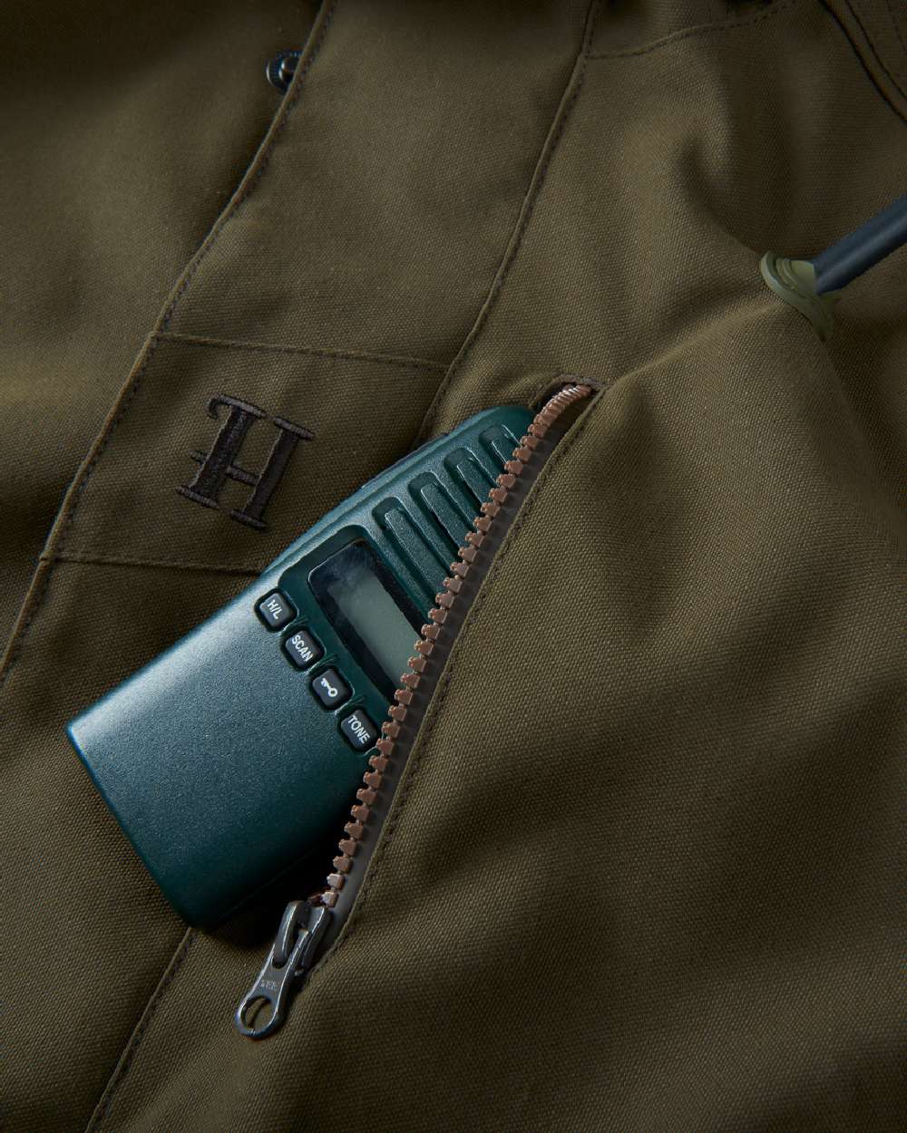 Willow Green Coloured Harkila Pro Hunter Endure Jacket on outdoor background #colour_willow-green