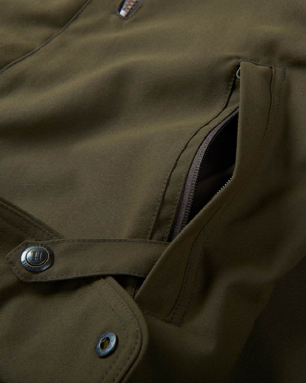 Willow Green Coloured Harkila Pro Hunter Endure Jacket on outdoor background #colour_willow-green