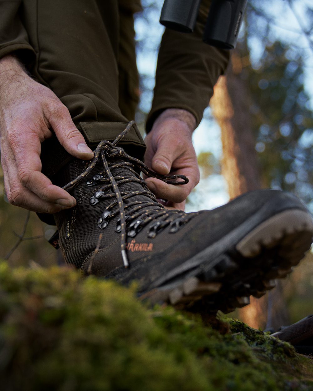 Shadow Brown Coloured Harkila Pro Hunter Light Mid GTX Boots on outdoor background #colour_shadow-brown