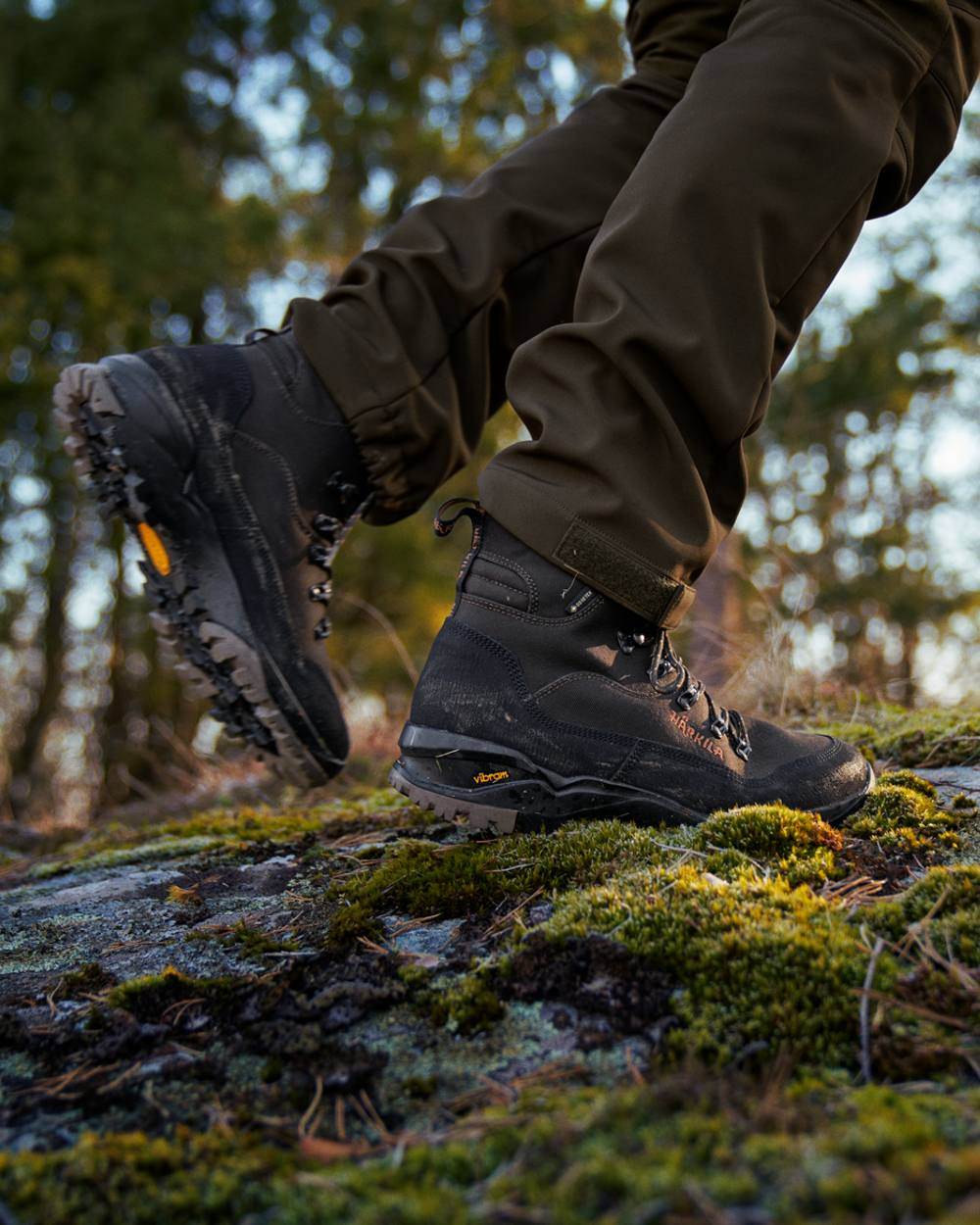 Shadow Brown Coloured Harkila Pro Hunter Light Mid GTX Boots on outdoor background #colour_shadow-brown