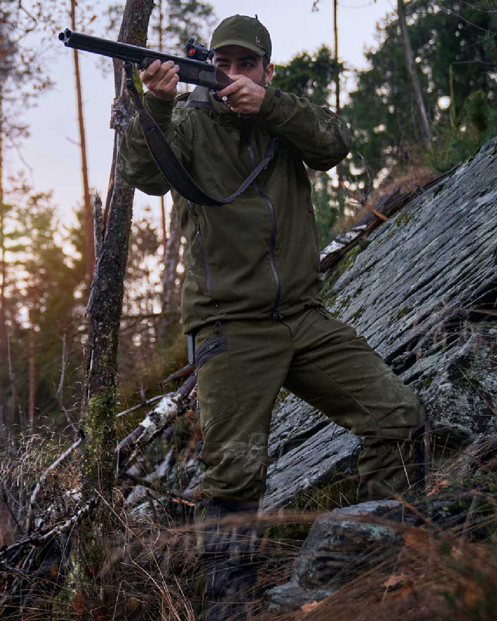 Willow Green Coloured Harkila Pro Hunter Move 2.0 GTX Jacket on outdoor background #colour_willow-green