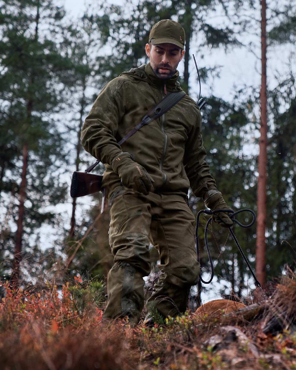 Willow Green Coloured Harkila Pro Hunter Move 2.0 GTX Jacket on outdoor background #colour_willow-green