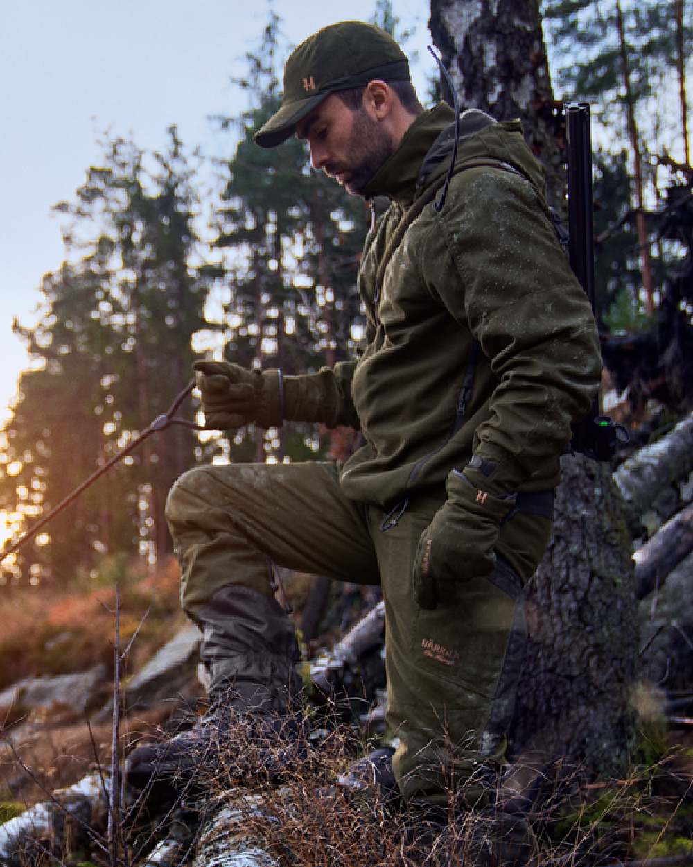 Willow Green Coloured Harkila Pro Hunter Move 2.0 GTX Jacket on outdoor background #colour_willow-green