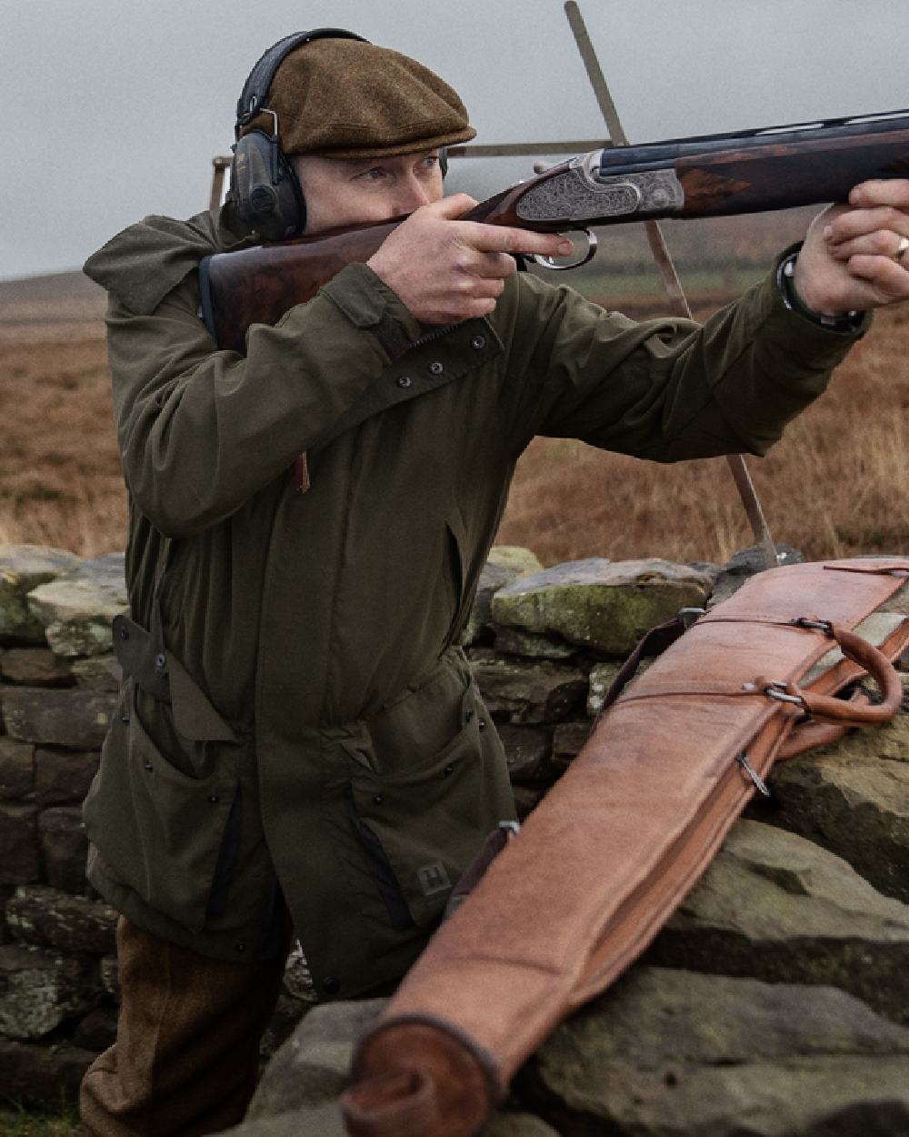 Willow Green Coloured Harkila Pro Hunter Shooting GTX Jacket on outdoor background #colour_willow-green