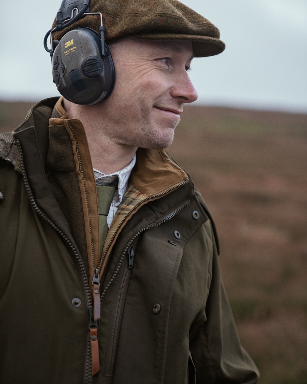 Willow Green Coloured Harkila Pro Hunter Shooting GTX Jacket on outdoor background #colour_willow-green