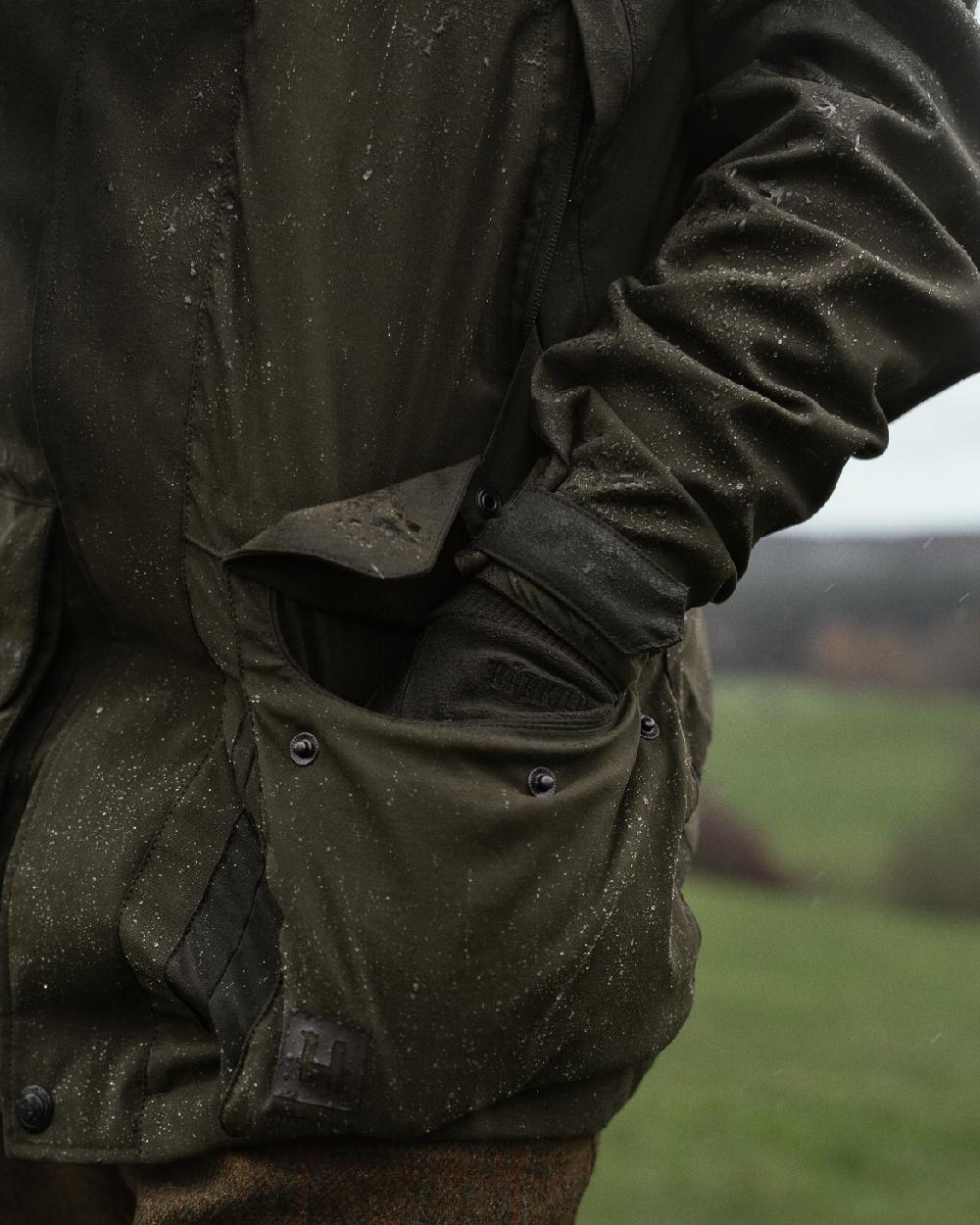 Willow Green Coloured Harkila Pro Hunter Shooting GTX Jacket on outdoor background #colour_willow-green