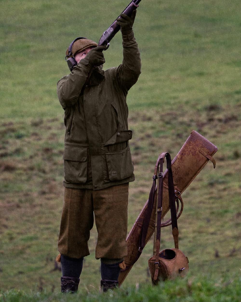 Willow Green Coloured Harkila Pro Hunter Shooting GTX Jacket on outdoor background #colour_willow-green