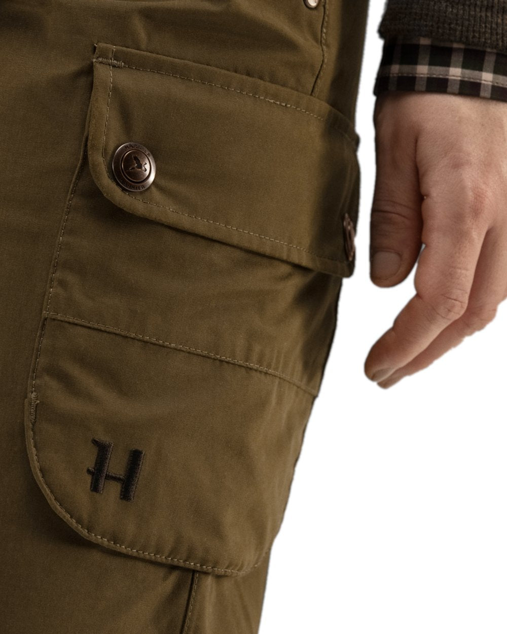 Warm Olive Coloured Harkila Retrieve Lady Trousers on white background #colour_warm-olive