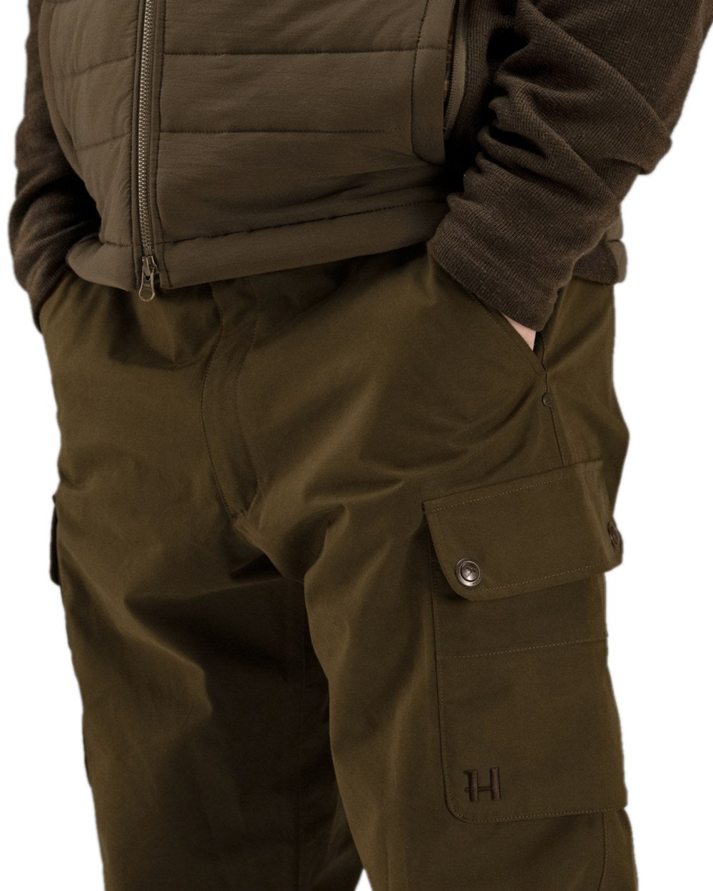 Warm Olive Coloured Harkila Retrieve Trousers on white background #colour_warm-olive