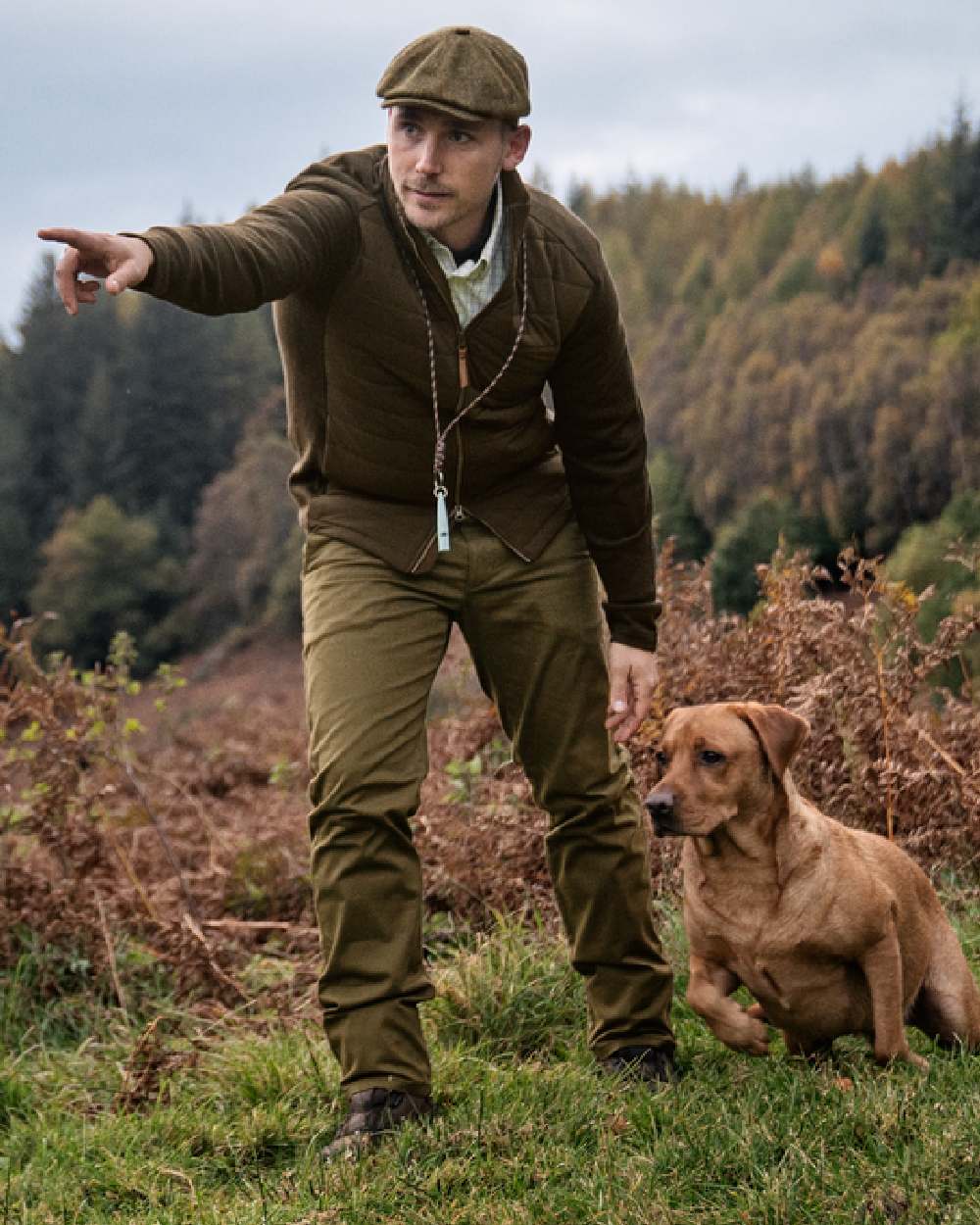 Willow Green Coloured Harkila Sandhem Pro Insulated Cardigan on forest background #colour_willow-green