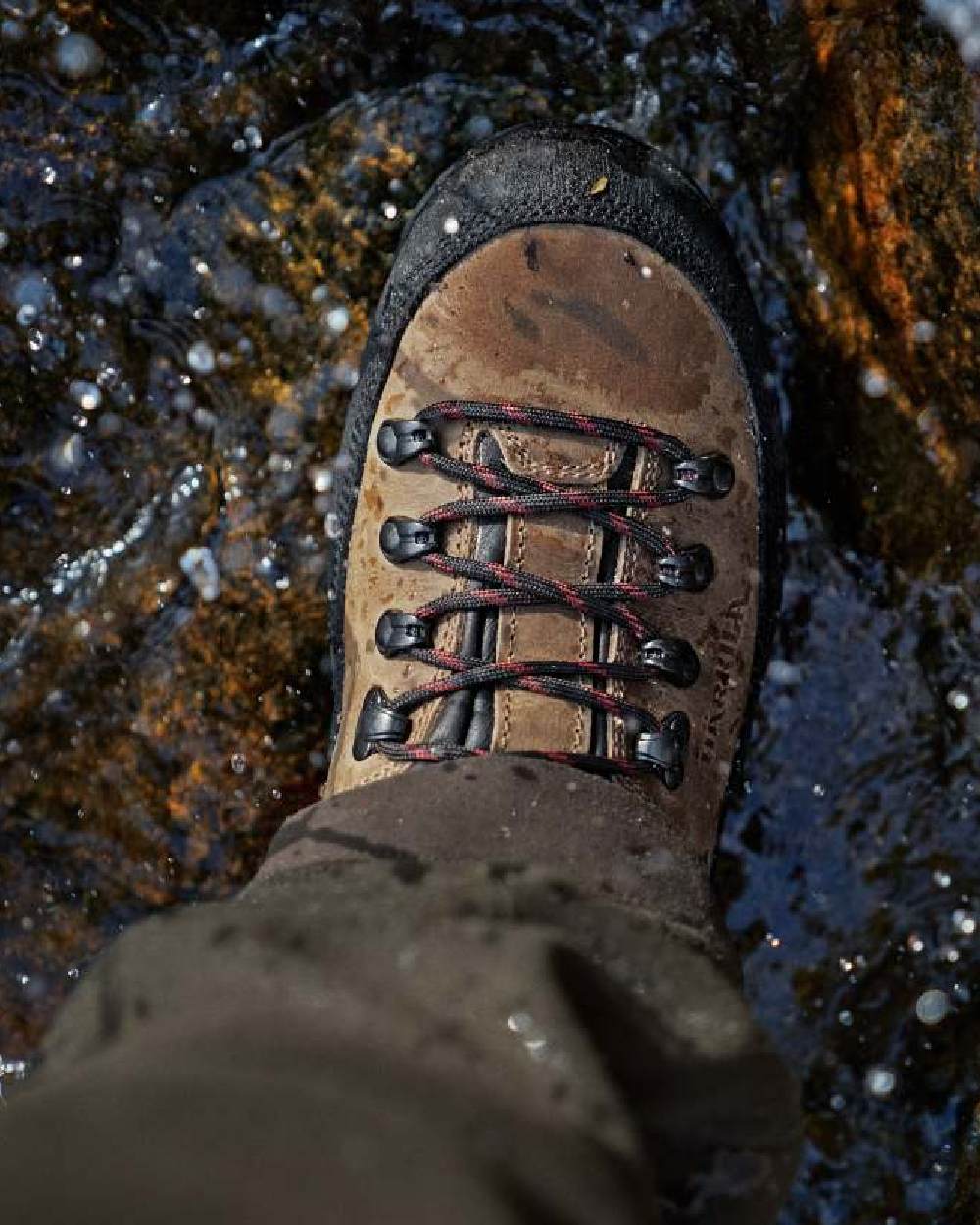 Mid Brown Coloured Harkila Saxnas Womens GTX Boots on water background #colour_mid-brown