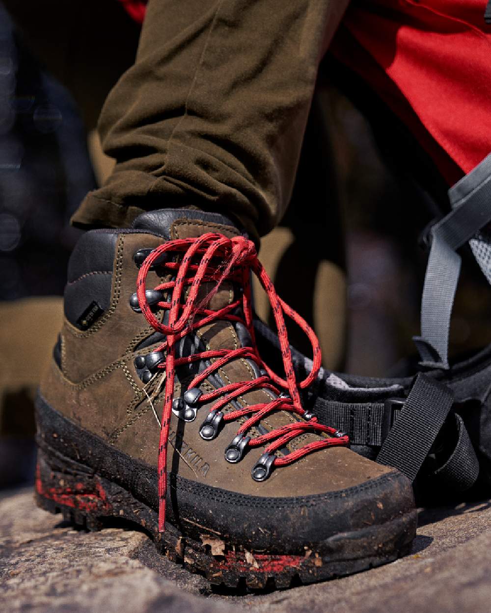 Willow Green Coloured Harkila Saxnas Womens GTX Boots on blurry background #colour_willow-green