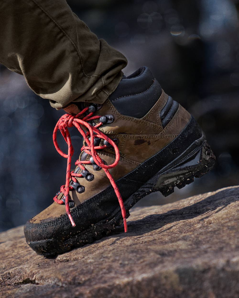 Willow Green Coloured Harkila Saxnas Womens GTX Boots on blurry background #colour_willow-green