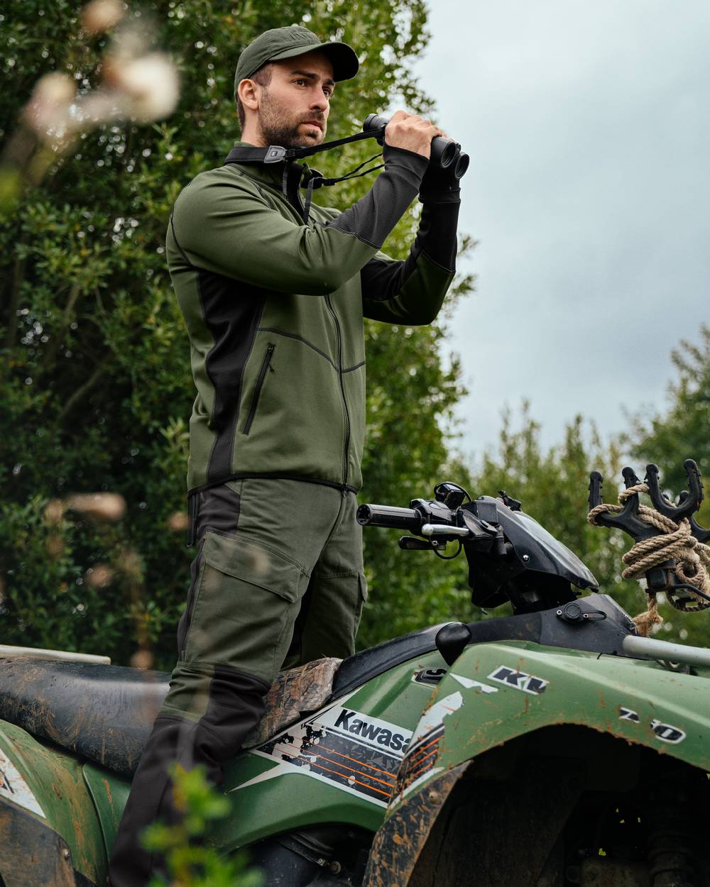 Duffel Green Black Coloured Harkila Scandinavian Fleece Jacket on outdoor background #colour_duffel-green-black