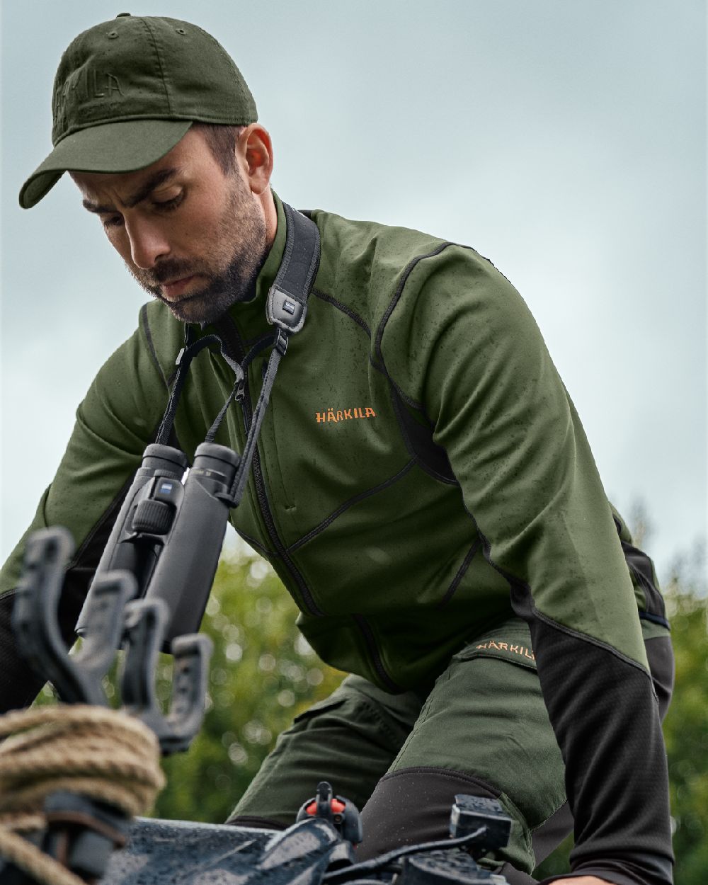 Duffel Green Black Coloured Harkila Scandinavian Fleece Jacket on outdoor background #colour_duffel-green-black