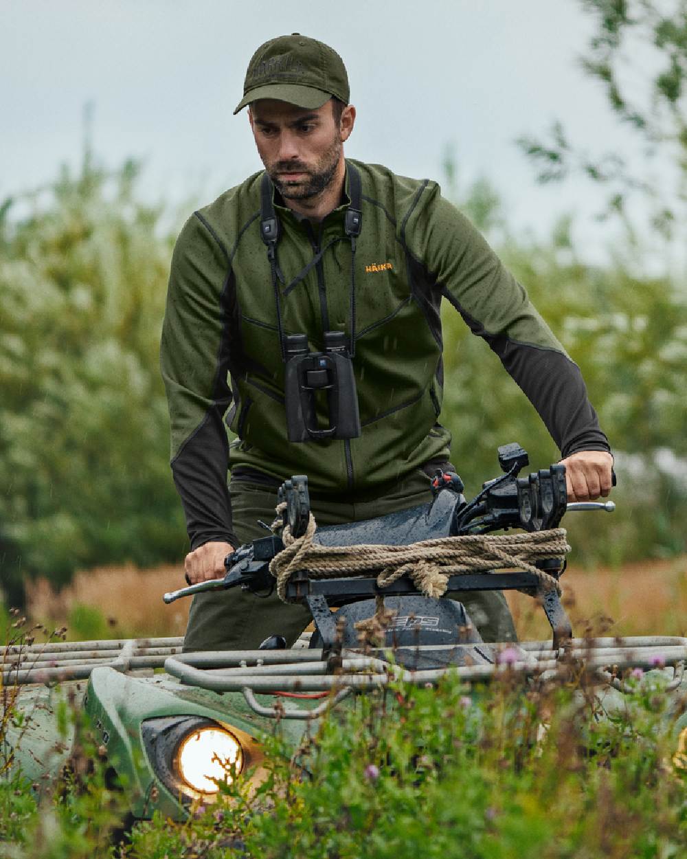 Duffel Green Black Coloured Harkila Scandinavian Fleece Jacket on outdoor background #colour_duffel-green-black