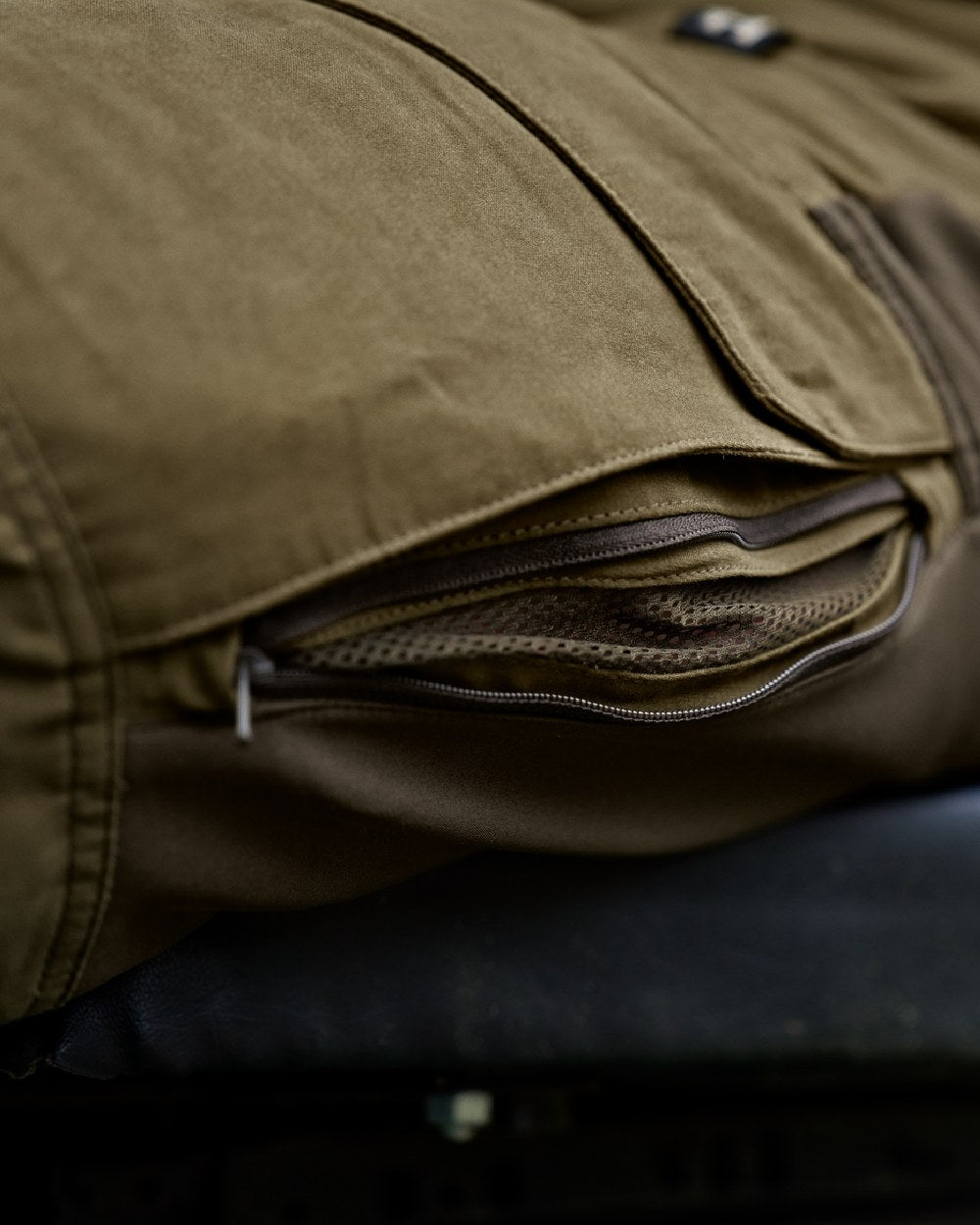 Dark Olive Willow Green Coloured Harkila Scandinavian Trousers on outdoor background #colour_dark-olive-willow-green