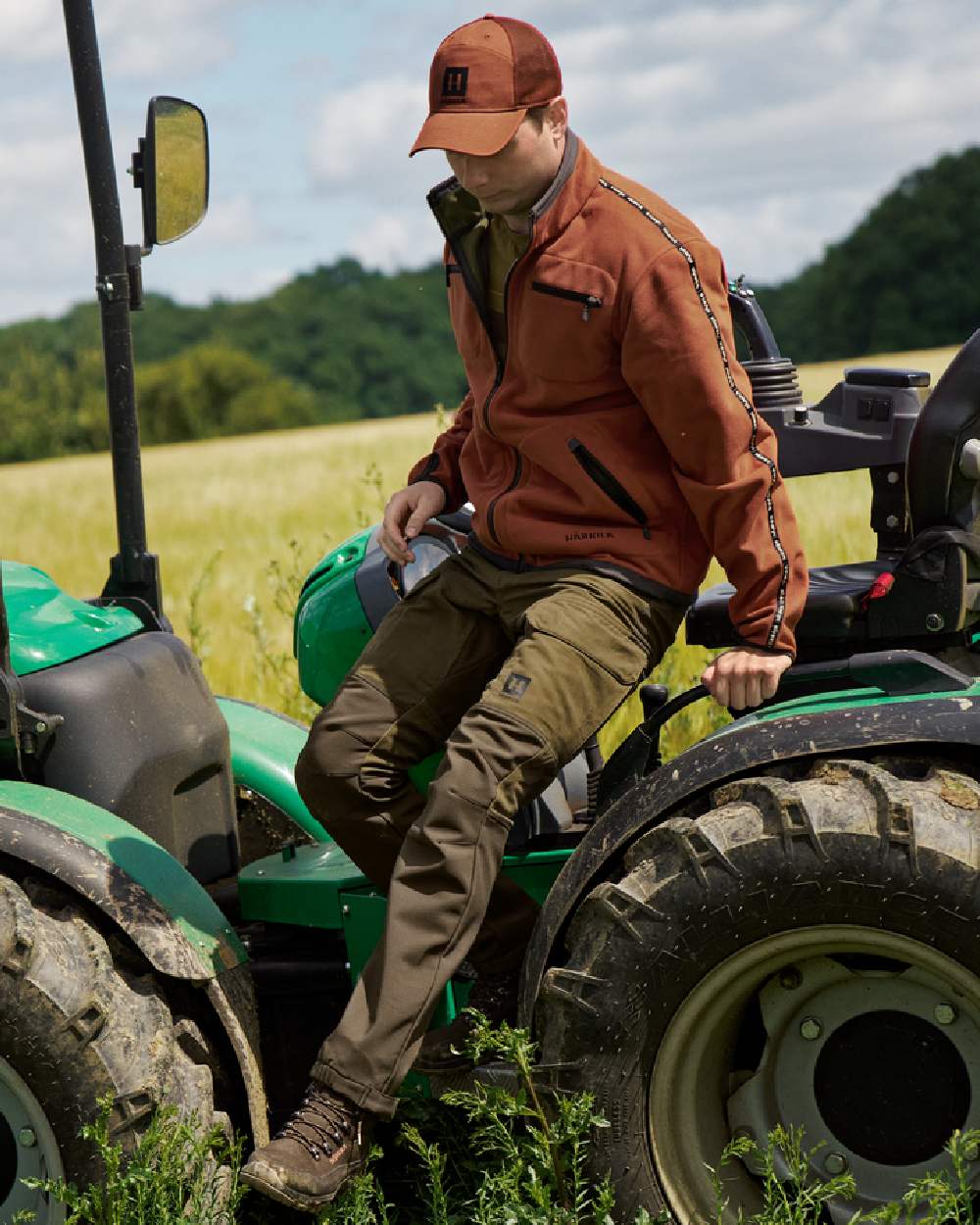Dark Olive Willow Green Coloured Harkila Scandinavian Trousers on outdoor background #colour_dark-olive-willow-green