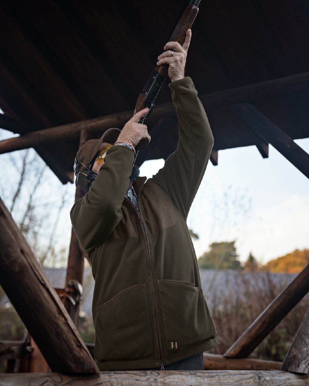 Willow Green Coloured Harkila Stornoway Active Shooting HSP Jacket on outdoor background #colour_willow-green