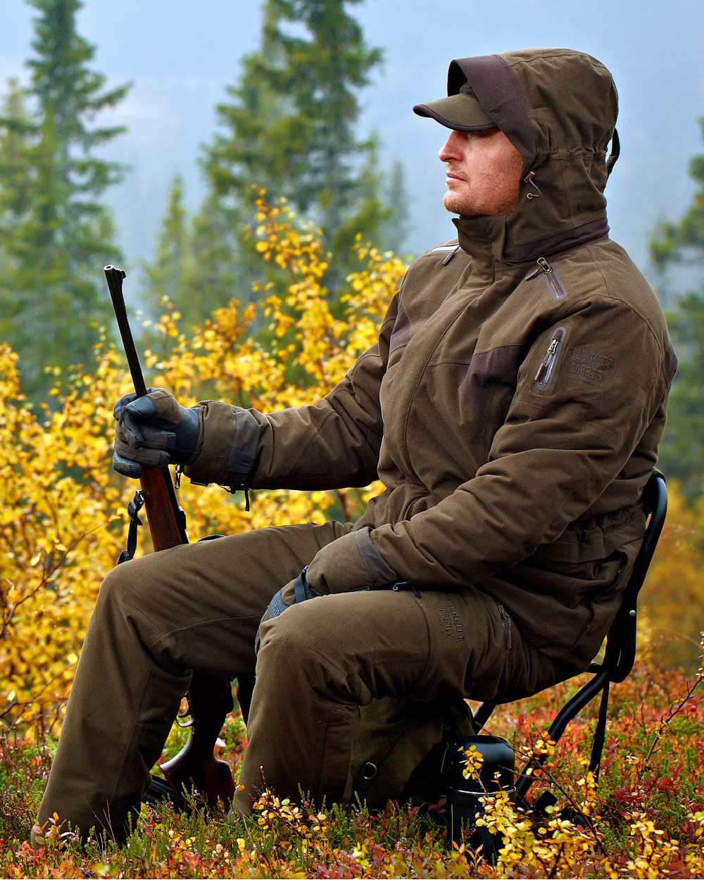 Hunting Green Coloured Harkila Visent Jacket on outdoor background #colour_hunting-green