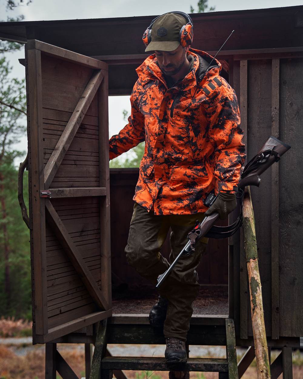AXIS Orange Blaze Coloured Harkila Wildboar Pro HWS Insulated Jacket on outdoor background #colour_axis-orange-blaze