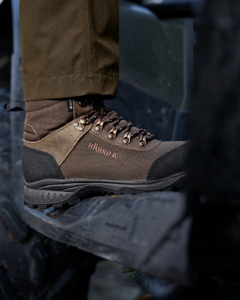 Mid Brown Coloured Harkila Wildwood 2.0 GTX Womens Waterproof Boots on outdoor background #colour_mid-brown