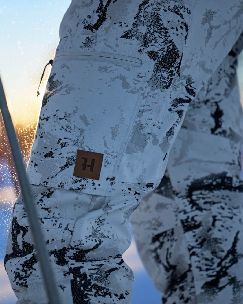 AXIS Snow Coloured Harkila Winter Active WSP Trousers on snow background #colour_axis-snow
