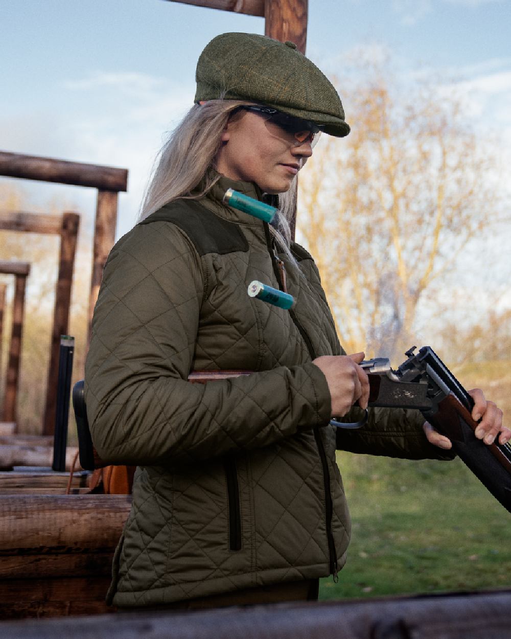 Willow Green Coloured Harkila Womens Ailsa Quilted Jacket on outdoor background #colour_willow-green