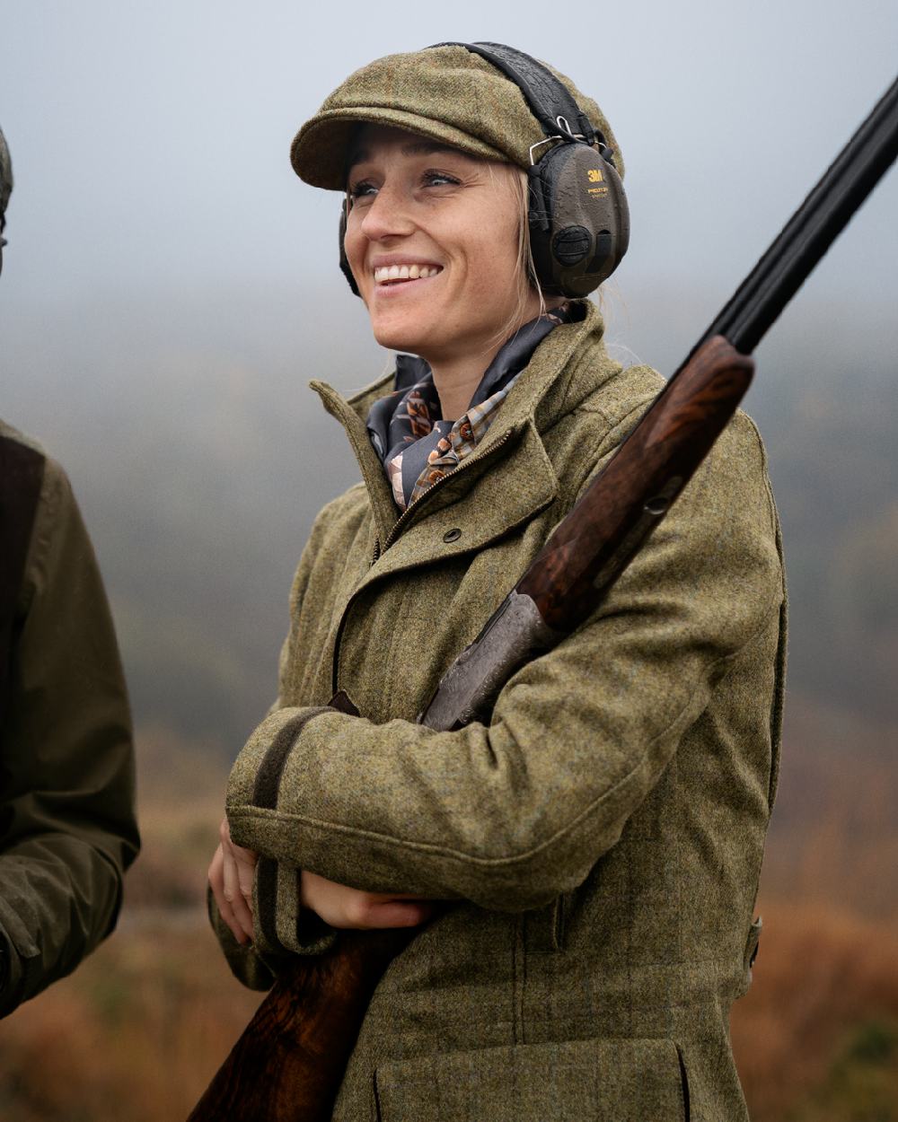 Olive Coloured Harkila Womens Jura GTX Jacket on fog background #colour_olive